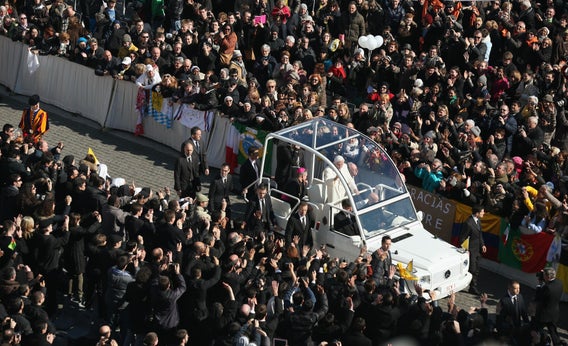 Pope Benedict XVI travels in the Popemobile through St. Peter's Square on Feb. 27, 2013, in Vatican City.