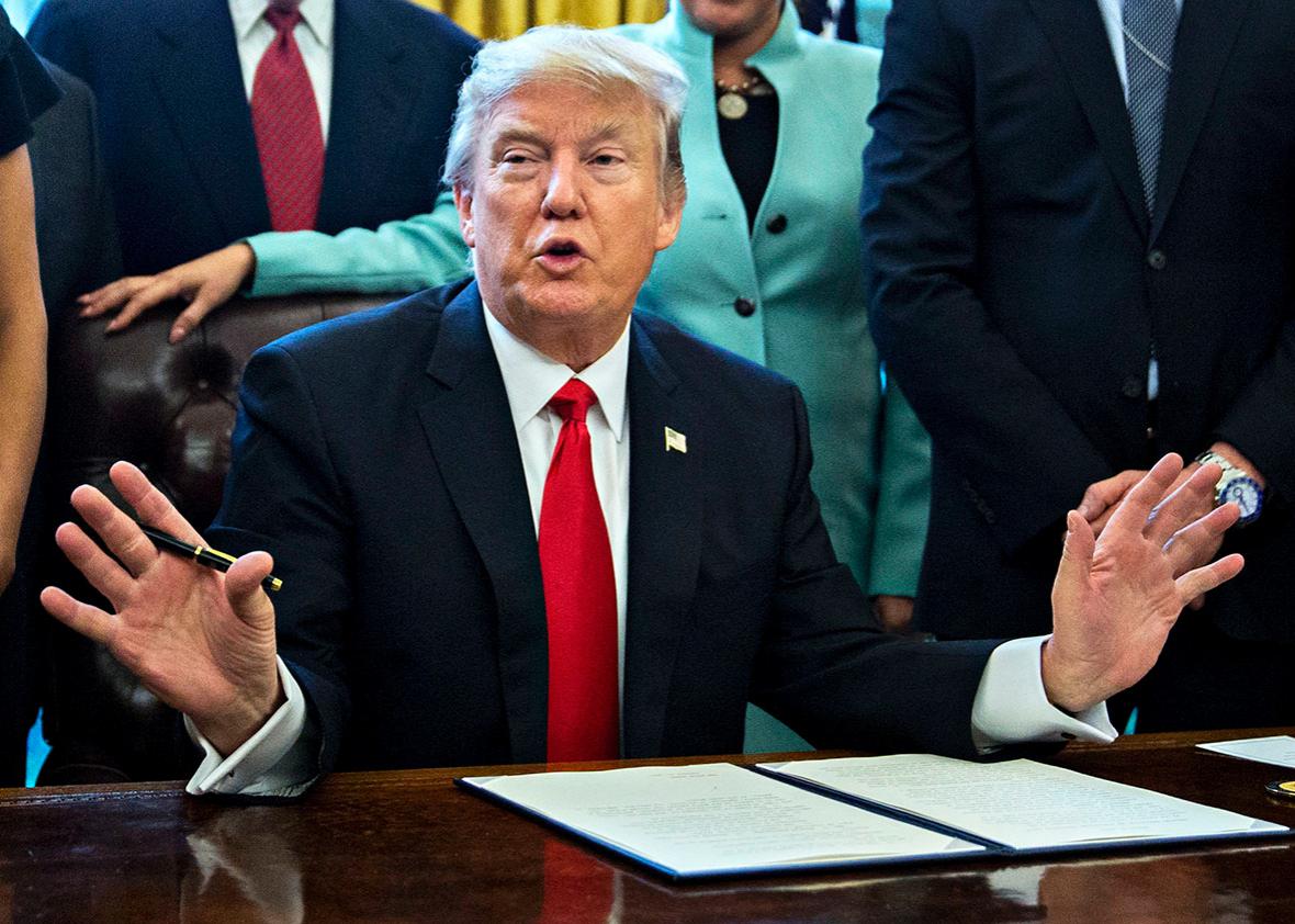 U.S. President Donald Trump speaks before signing an executive order surrounded by small business leaders in the Oval Office of the White House January 30, 2017 in Washington, DC. 