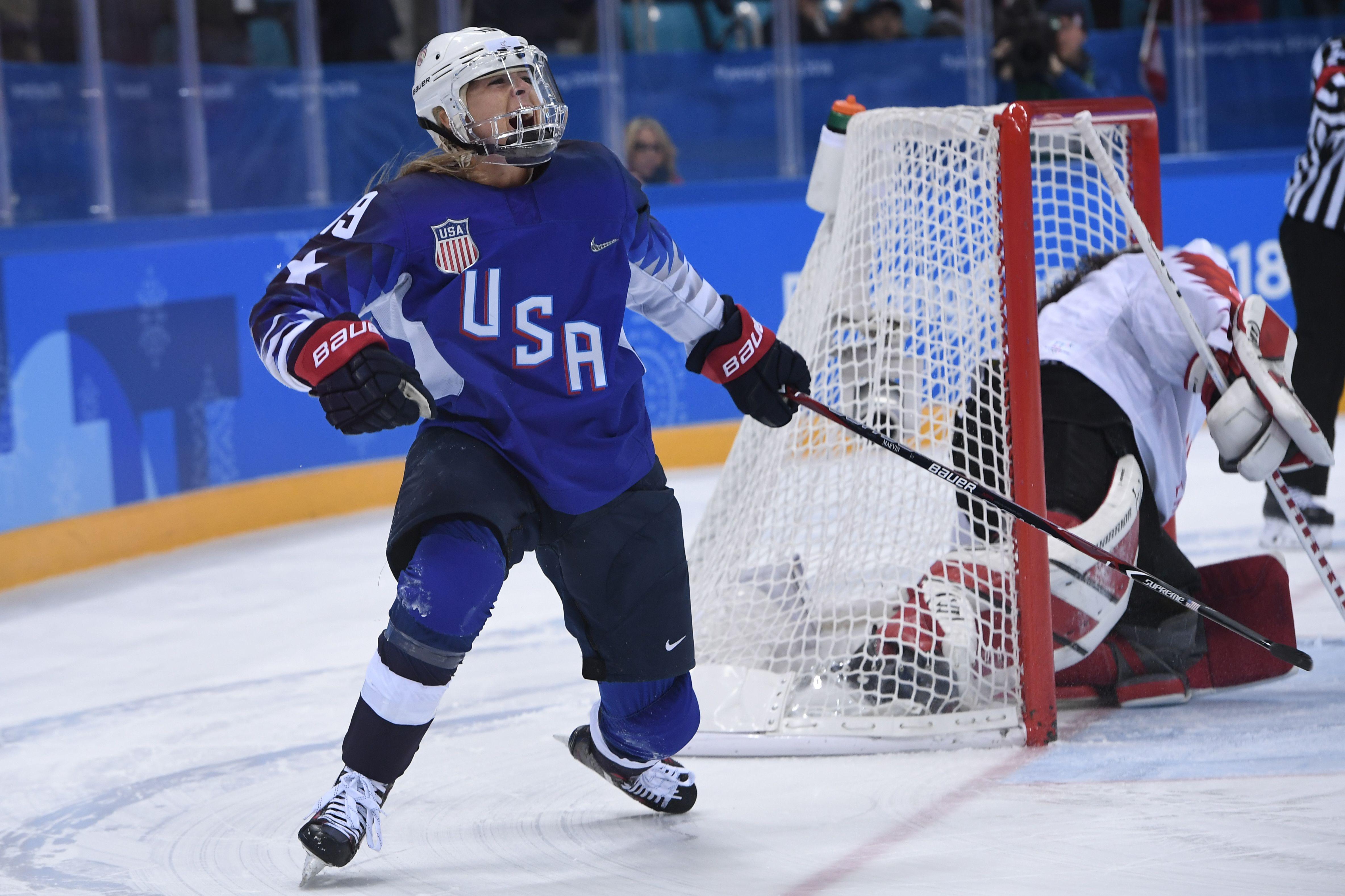 USA's Gigi Marvin scores during the penalty-shot shootout in the women's gold medal ice hockey match between the US and Canada during the Pyeongchang 2018 Winter Olympic Games at the Gangneung Hockey Centre in Gangneung on February 22, 2018. / AFP PHOTO / JUNG Yeon-Je (Photo credit should read JUNG YEON-JE/AFP/Getty Images)