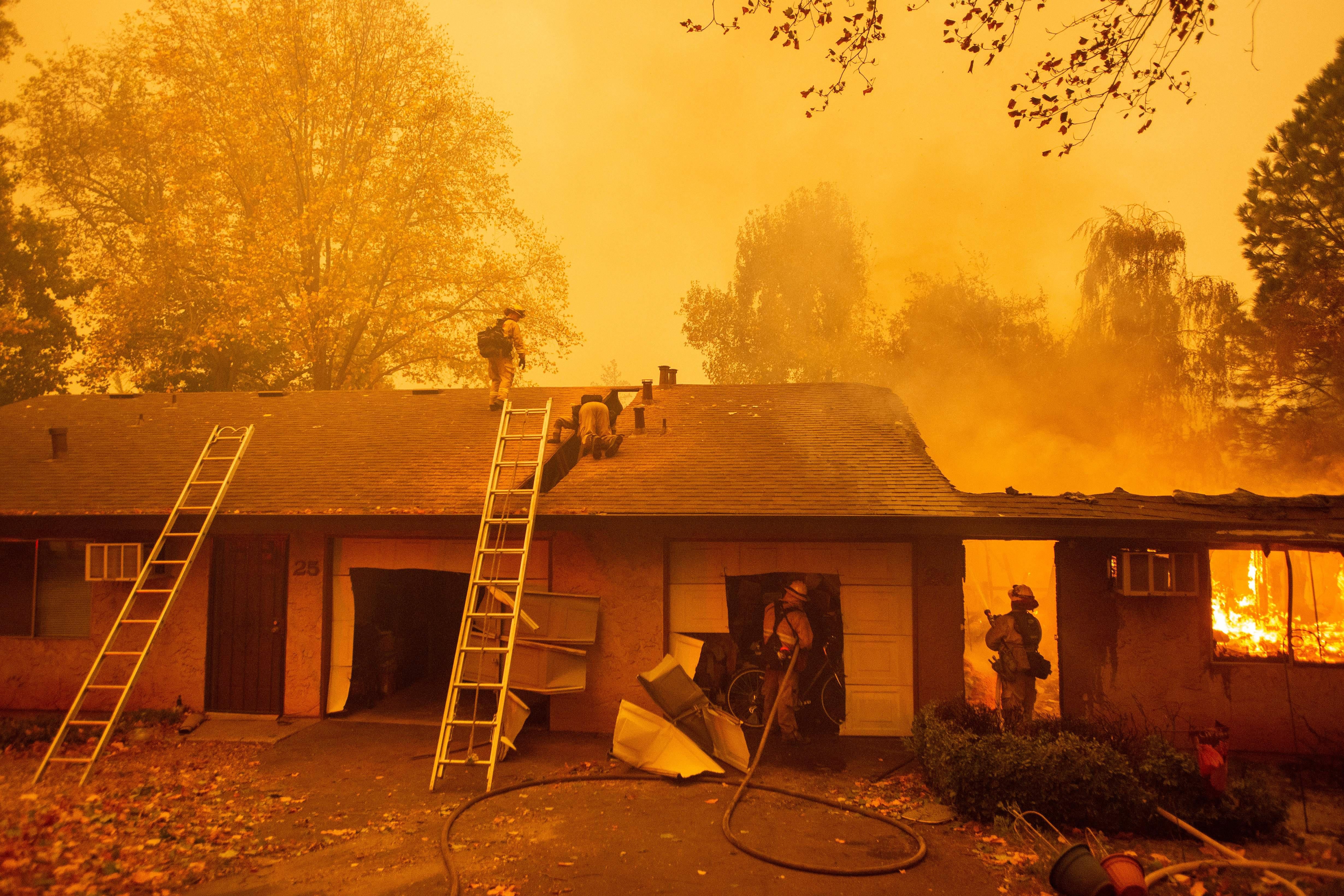 Firefighters battle flames at an apartment complex.