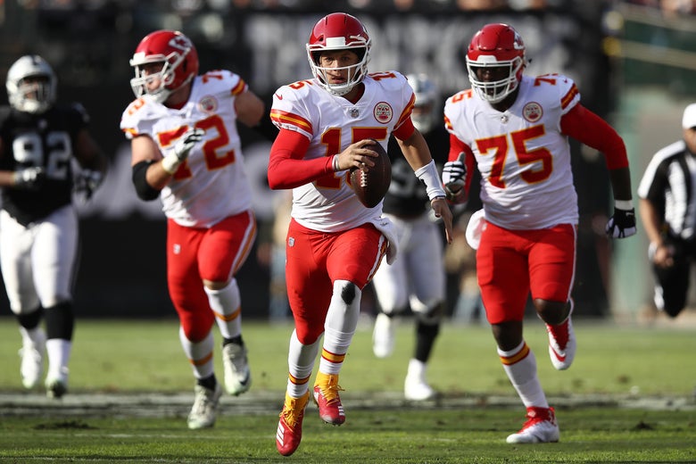 OAKLAND, CA - DECEMBER 02: Patrick Mahomes #15 of the Kansas City Chiefs scrambles with the ball against the Oakland Raiders during their NFL game at Oakland-Alameda County Coliseum on December 2, 2018 in Oakland, California. (Photo by Ezra Shaw/Getty Images)