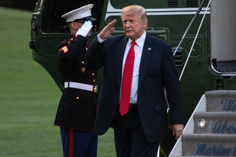 President Donald Trump salutes upon his return to the White House in Washington, D.C., on July 26, 2018. 