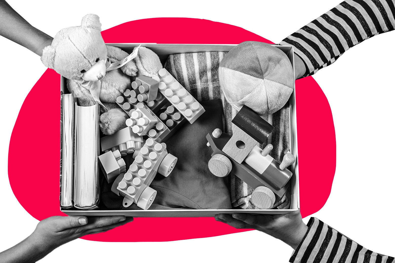 Hands handing over a box filled with kids' toys to another set of hands.