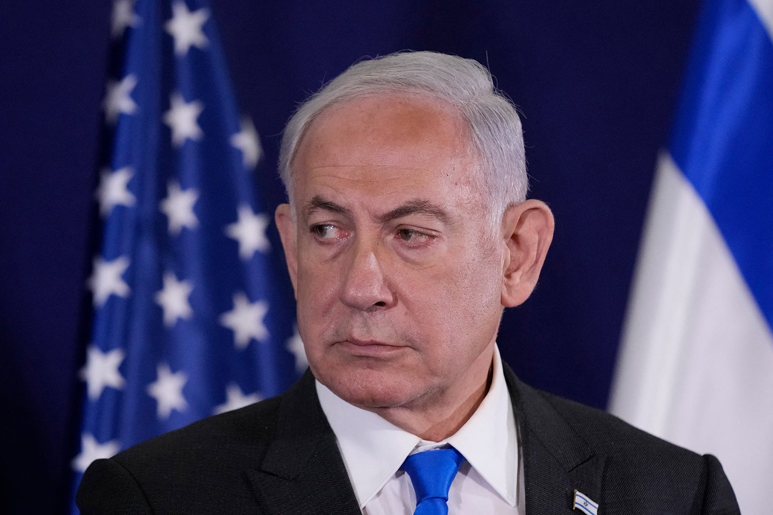 Netanyahu looks off to the side nervously.
