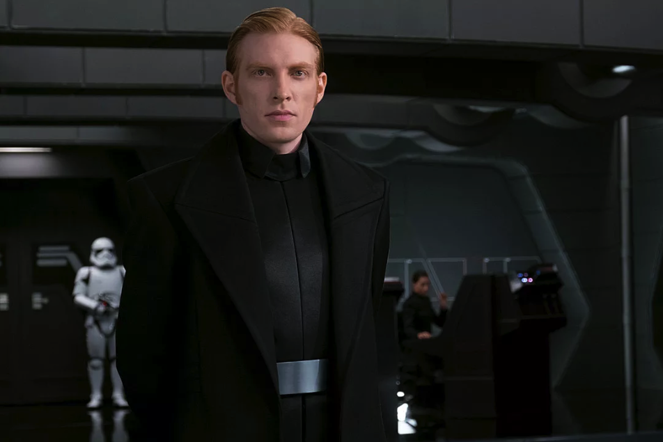General Hux stands on the bridge of his star destroyer.