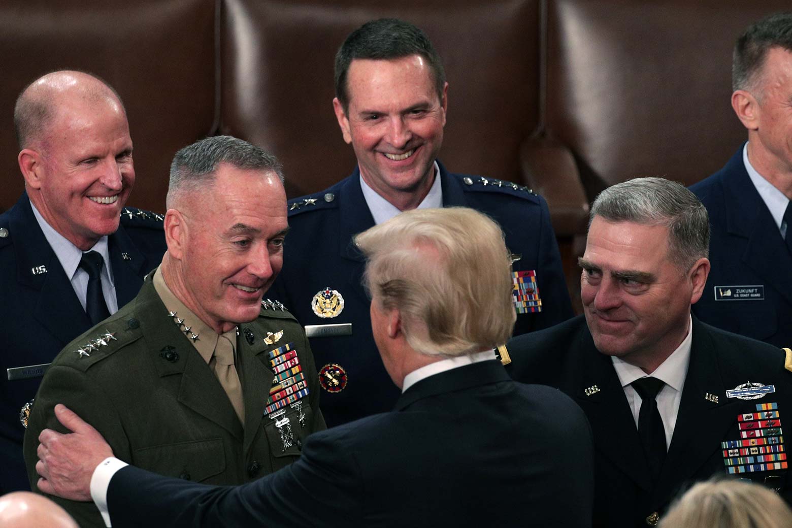 Trump greeting Dunford and other military officials.