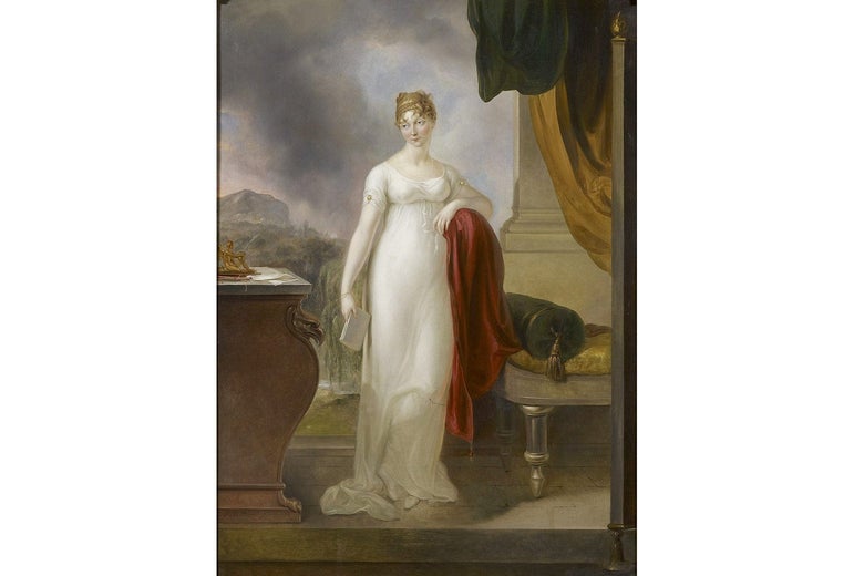 A painting of a woman wearing a long white gown pooling around her ankles. She holds a book and leans on a nearby chaise.