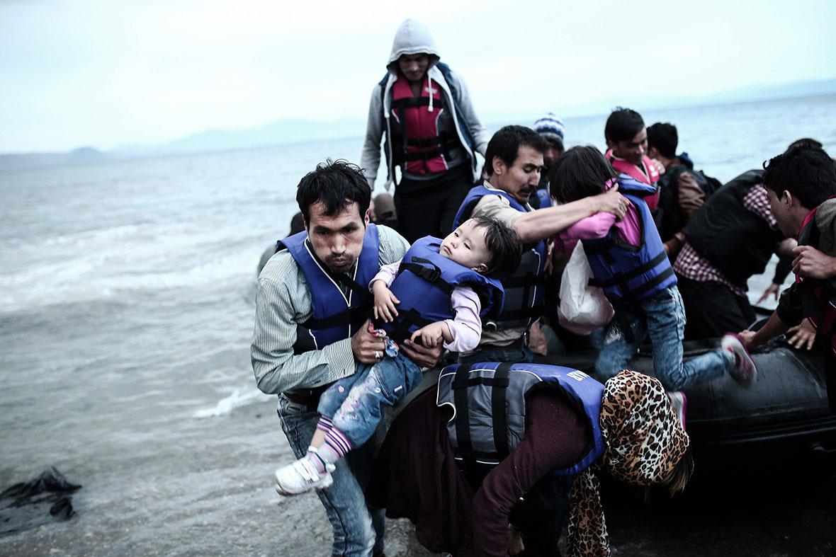 Afghan migrants arrive on a beach on the Greek island of Kos, af