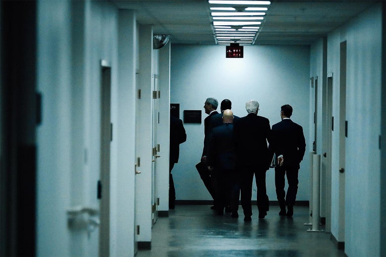 Robert Mueller disappearing into a back hallway.
