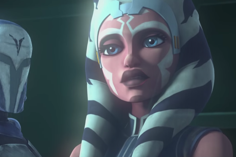 Ahsoka Tano appears as a hologram. To the left, a hint of a Mandalorian helmet can be seen.