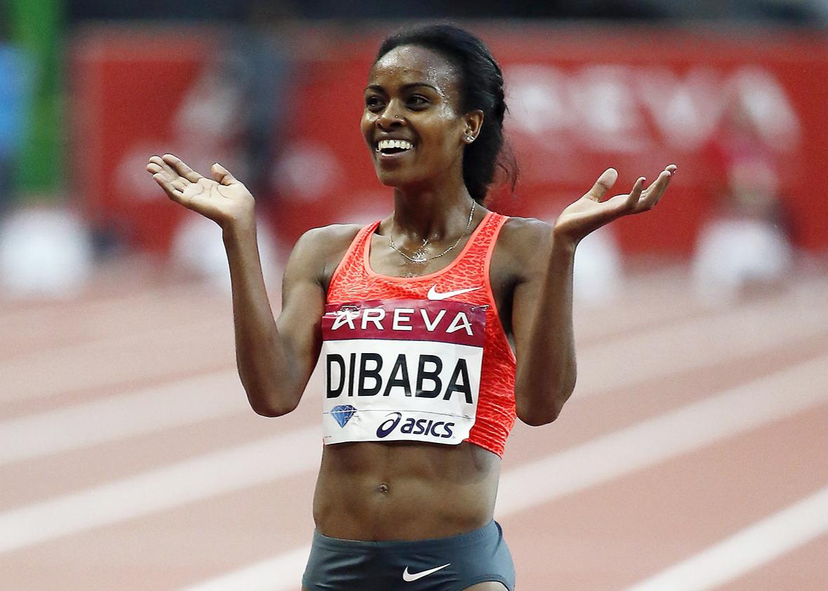 Ethiopia's Genzebe Dibaba celebrates after winning the women's 5000m during the IAAF Diamond League athletics meeting at the Stade de France in Saint-Denis, outside Paris, on July 4, 2015.