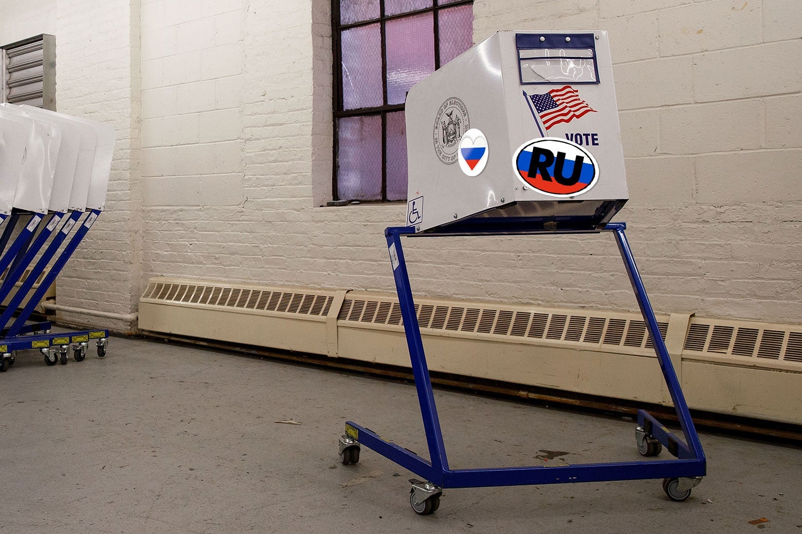 Photo illustration: Voting booths sit at a New York City Board of Elections voting machine facility warehouse on Nov. 3, 2016, in the Bronx borough of New York City. The machine has added Russian stickers on it.
