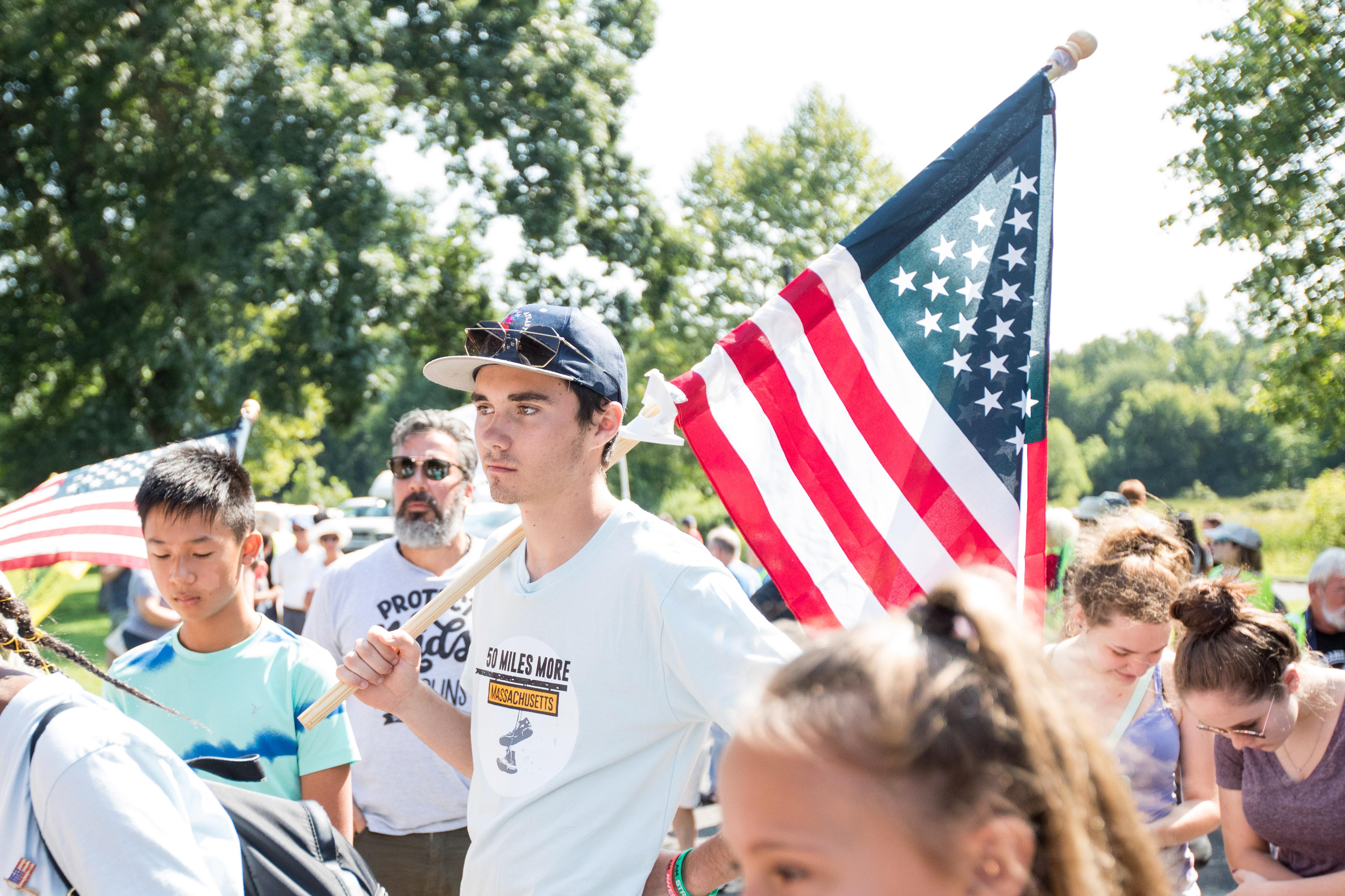 Activists including Parkland Shooting survivor and activist David Hogg gather before the final mile of the 50 Miles More walk against gun violence which ends with a rally at the Smith and Wesson Firearms factory on August 26, 2018 in Springfield, Massachusetts. 
