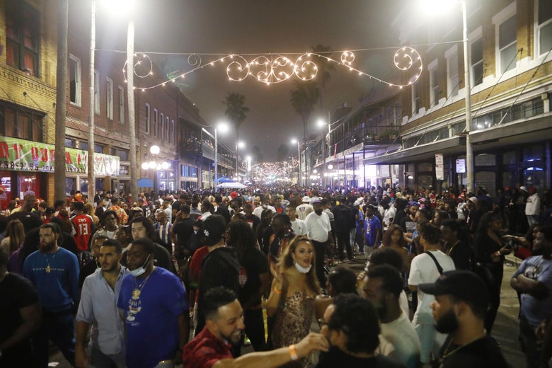 Large crowds gather in the Ybor City district on the eve Super Bowl LV on February 7, 2021 in Tampa, Florida. 