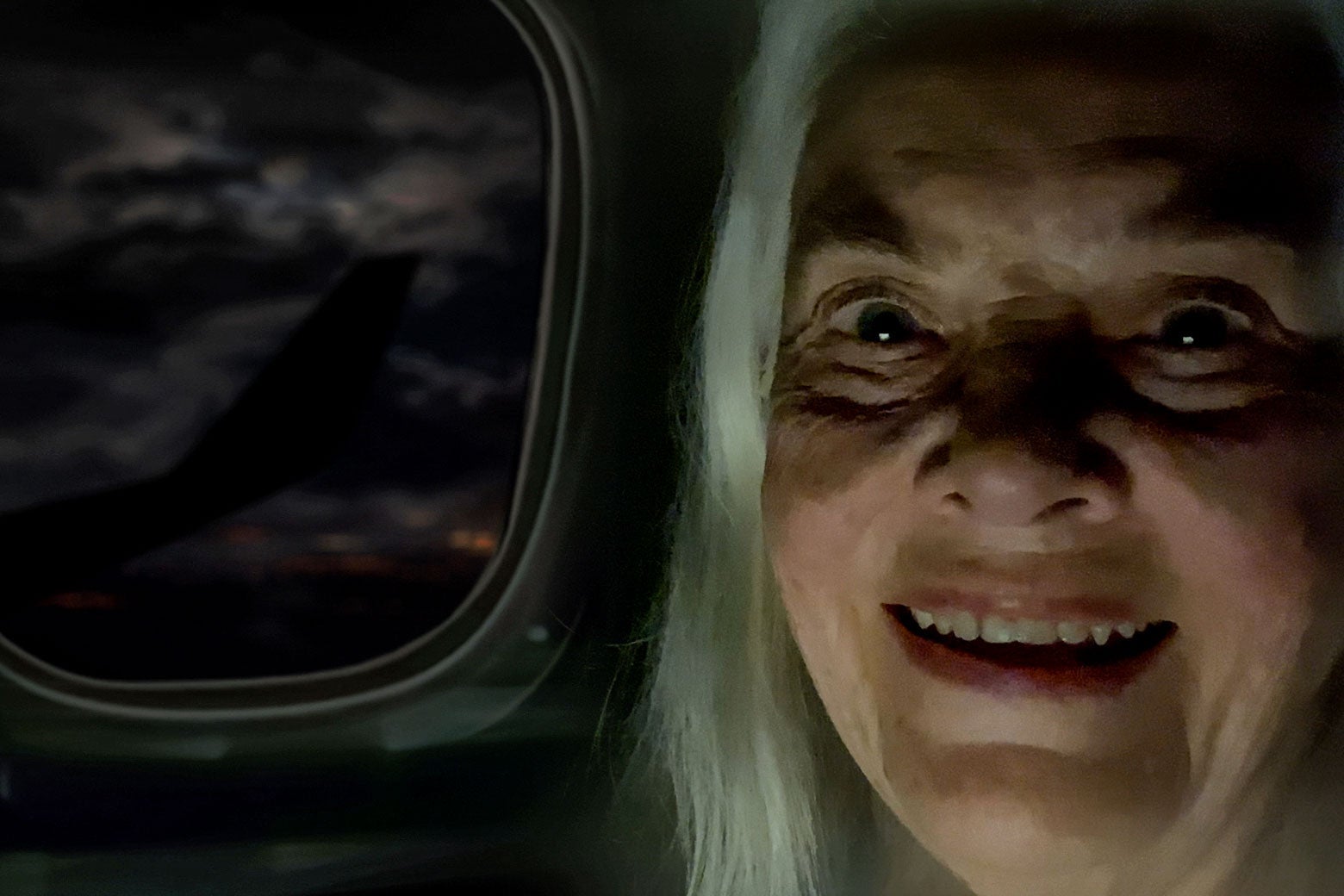 Lois Smith in front of a drawing of an airplane window.