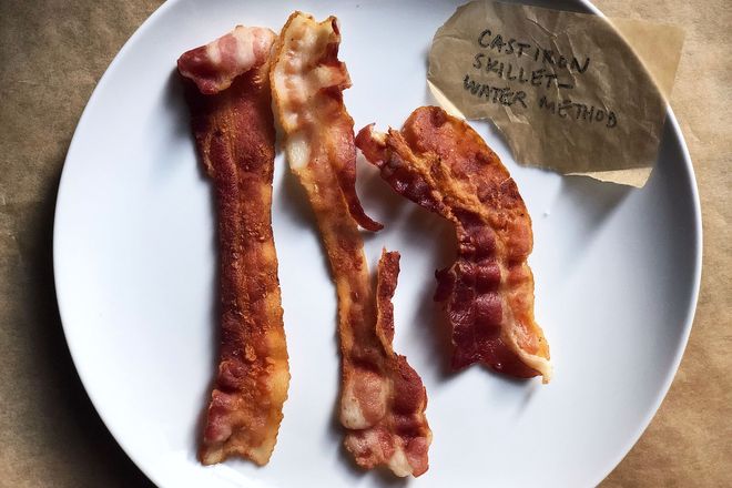 Bacon on a plate with a label: Cast Iron Skillet - Water Method. The strips are irregular in consistency.