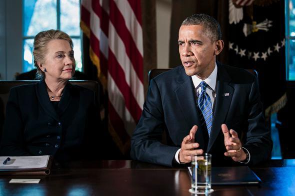 U.S. President Barack Obama (R) speaks as U.S. Secretary of Stat