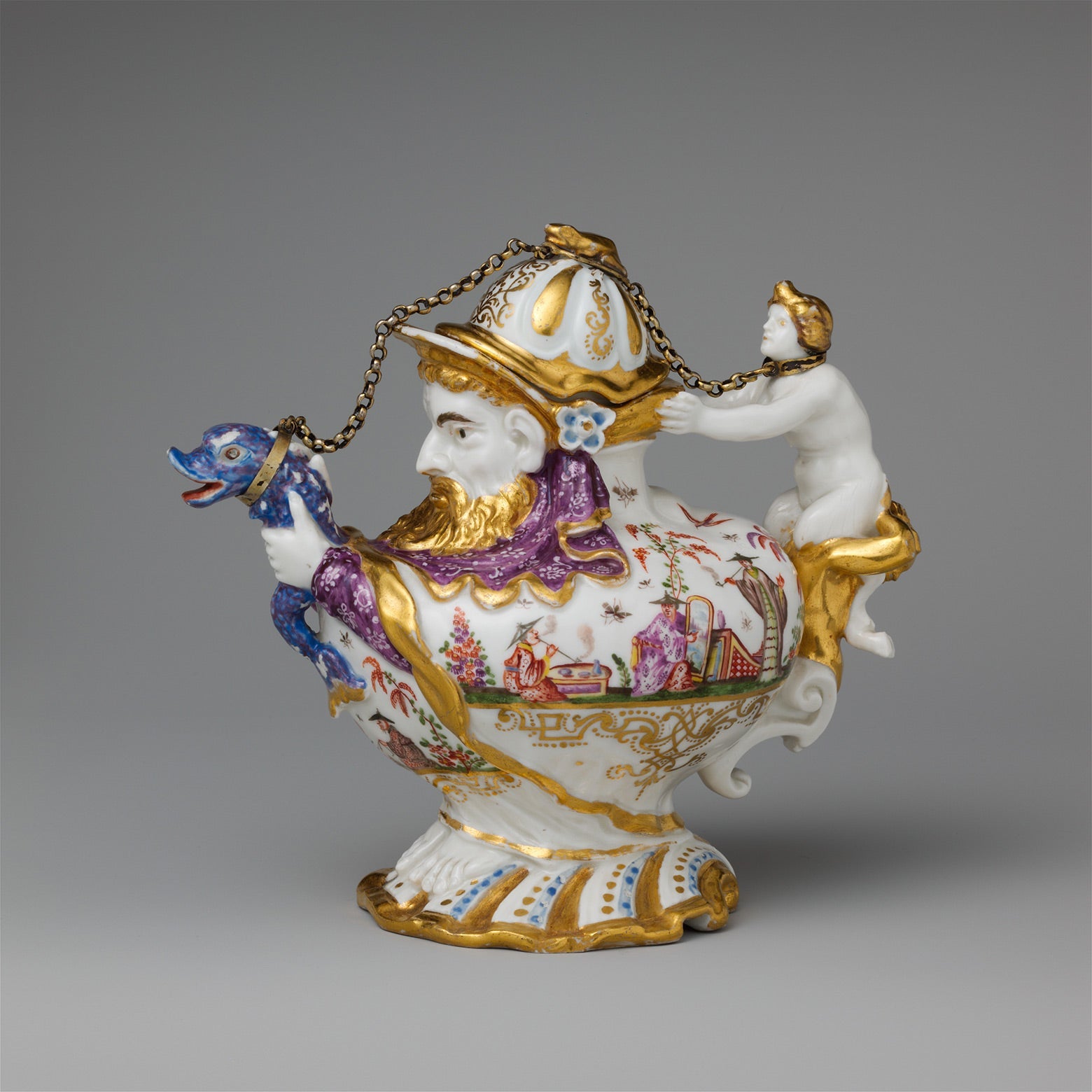 A teapot with a cover featuring a bearded man