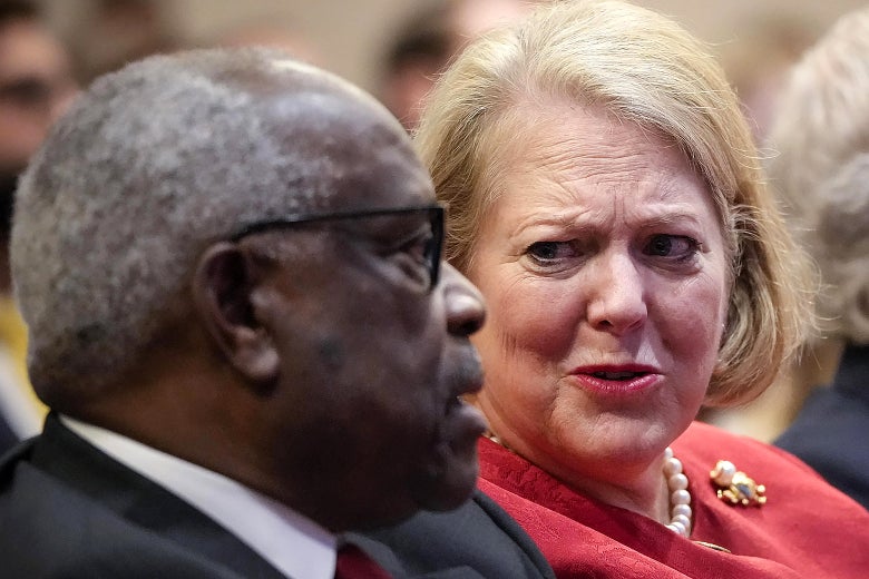 Justice Clarence Thomas sits side-by-side with his wife and conservative activist Virginia Thomas.