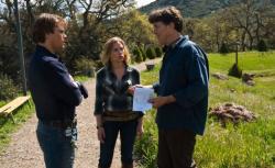 Photograph of Cameron Crowe giving direction to Matt Damon and Scarlett Johansson while filming 'We Bought a Zoo'