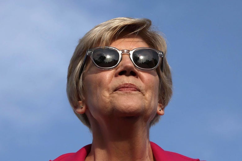A close-up of Elizabeth Warren outdoors wearing sunglasses.