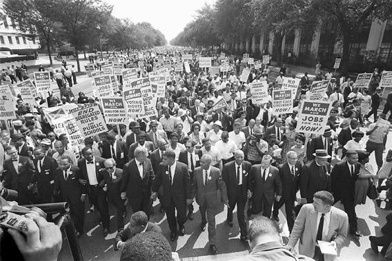 The clergyman and civil rights leader Martin Luther KIng (3rd from left) and other black and white civil right leaders march 28 August 1963 on the Mall in Washington DC during the "March on Washington".