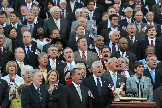Members of the Congress sing 'God Bless America' during an event commemorating the tenth anniversary of the Sept. 11 terrorist attacks, on September 12, 2011 on Capitol Hill in Washington, DC.
