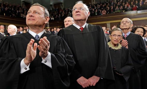 From left, Chief Justice John Roberts and Associate Justices Anthony Kennedy, Ruth Bader Ginsburg, Stephen Breyer and Sonia Sotomayor applaud before President Barack Obama's State of the Union address during a joint session of Congress on Capitol Hill in Washington, Tuesday Feb. 12, 2013. 