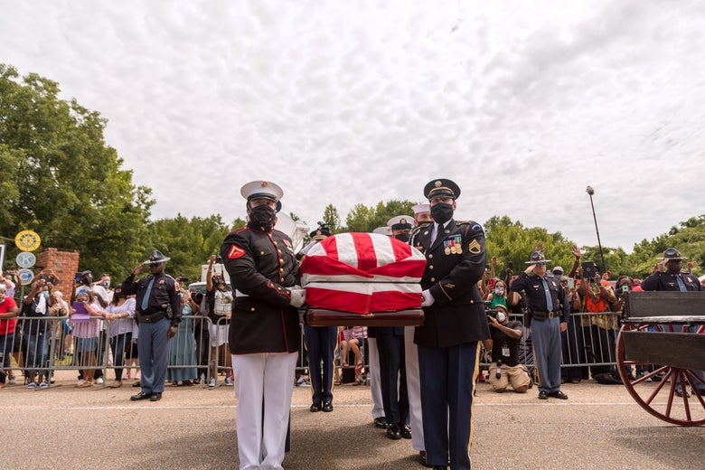 Military pallbearers prepare to place the body of former US Rep. John Lewis (D-GA) into a hearse after it was carried across Edmund Pettus Bridge on July 26, 2020 in Selma, Alabama.