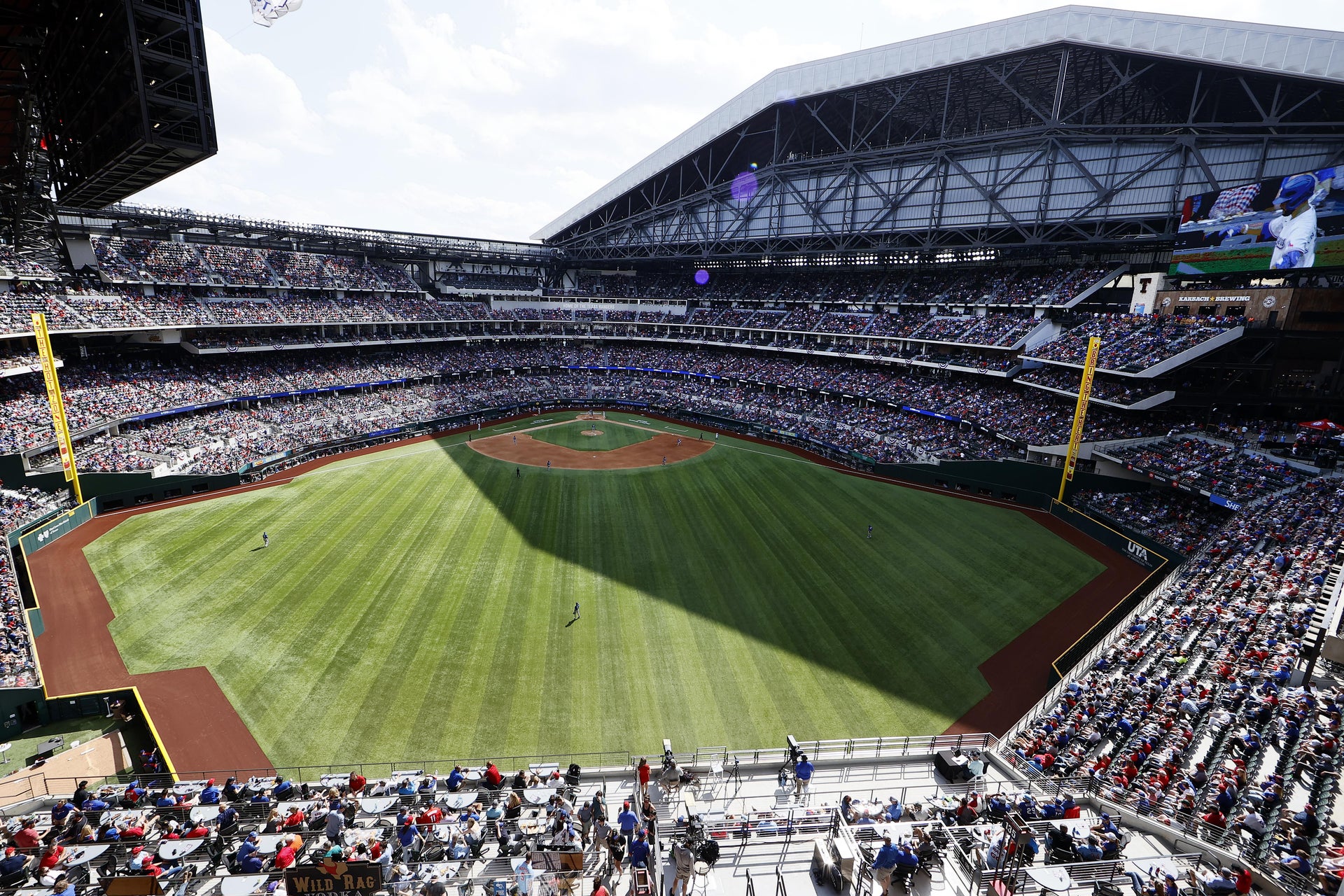 Texas Rangers play MLB home opener in front of packed stadium.