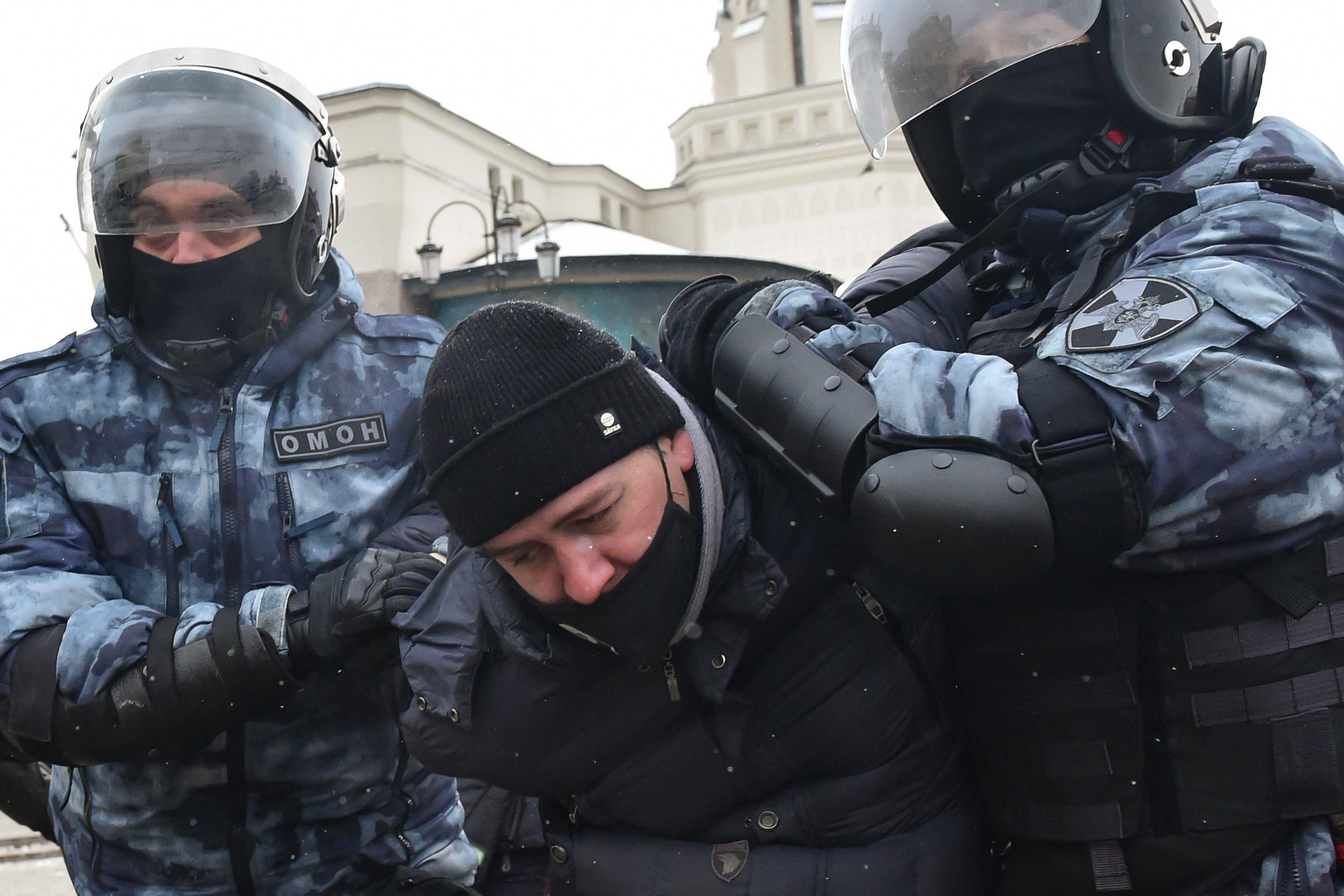 Riot police detain a man during a rally in support of jailed opposition leader Alexei Navalny in Moscow on January 31, 2021.