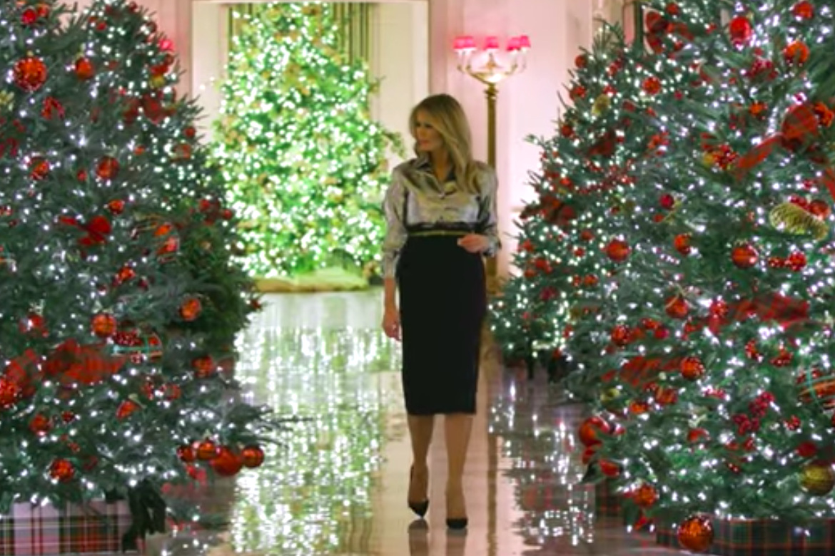 Melania Trump among Christmas trees.