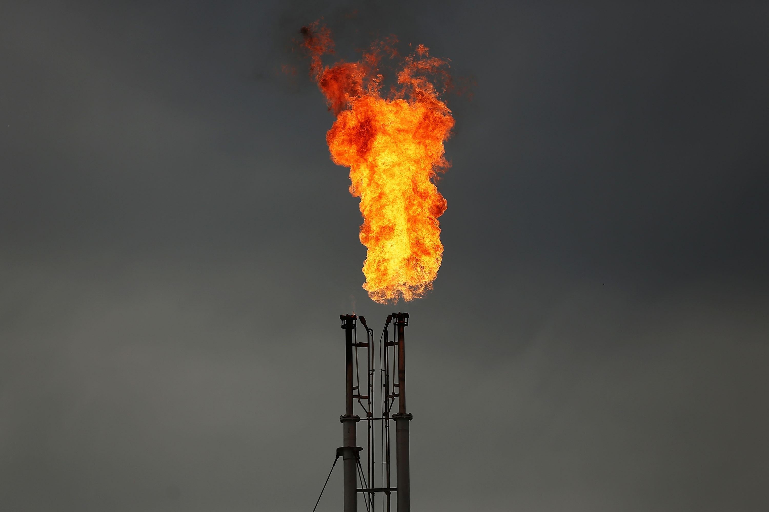 A natural gas plant shoots out flames.