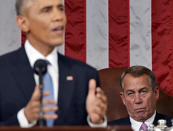 House Speaker John Boehner (R-OH) listens to President Obama deliver the State of the Union address.