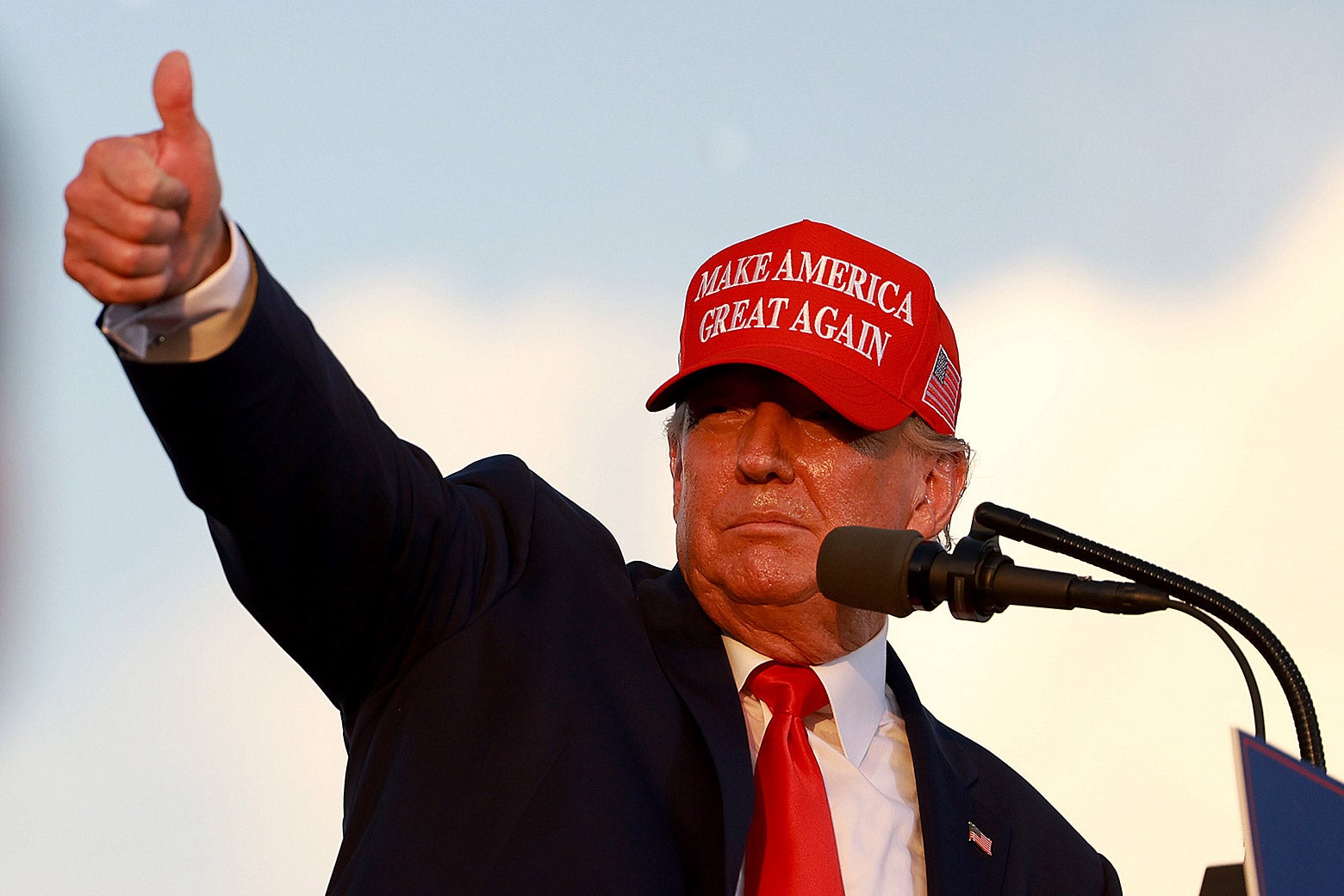 Donald Trump gives a thumbs up during a rally.