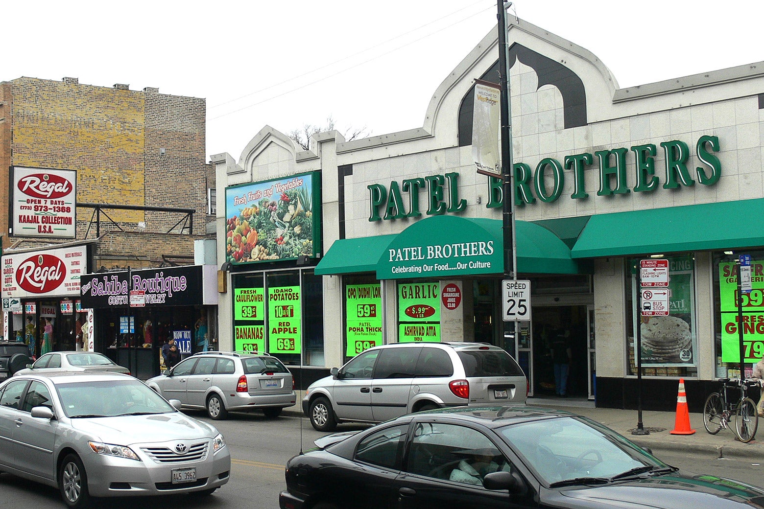 The Patel Brothers grocery store, with cars on Devon Avenue out front.
