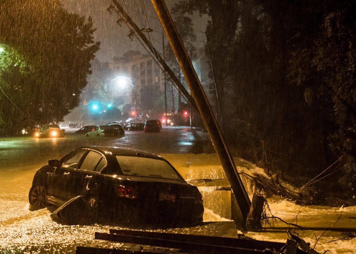 An abandoned vehicle sits in flood water the morning of Oct. 4, 2015, in Columbia, South Carolina.