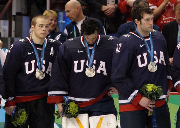 Dejected Team USA players look on after receiving the silver medal won during the ice hockey men's gold medal game between USA and Canada on day 17 of the Vancouver 2010 Winter Olympics.