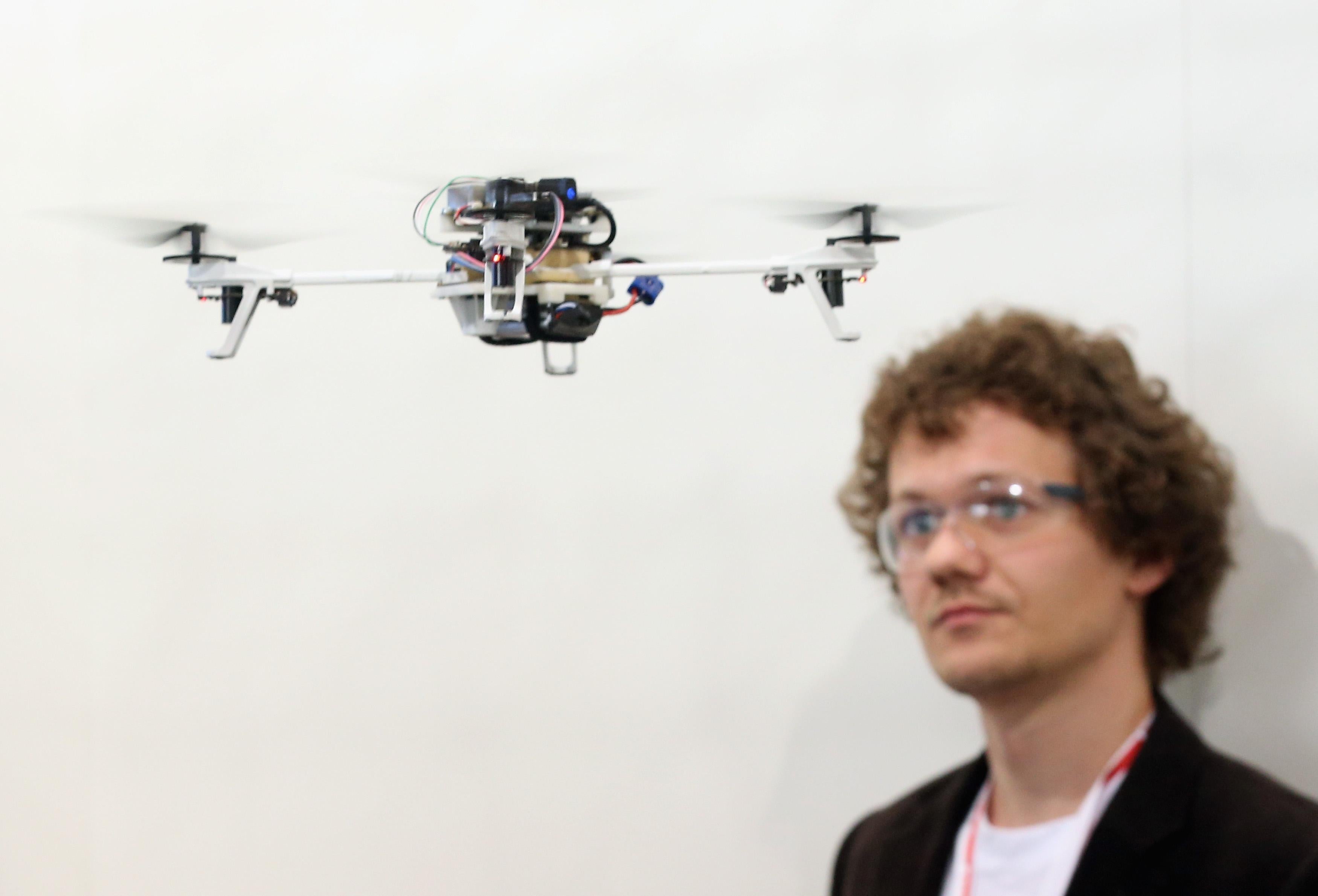 A student from the University of Zurich watches a drone.