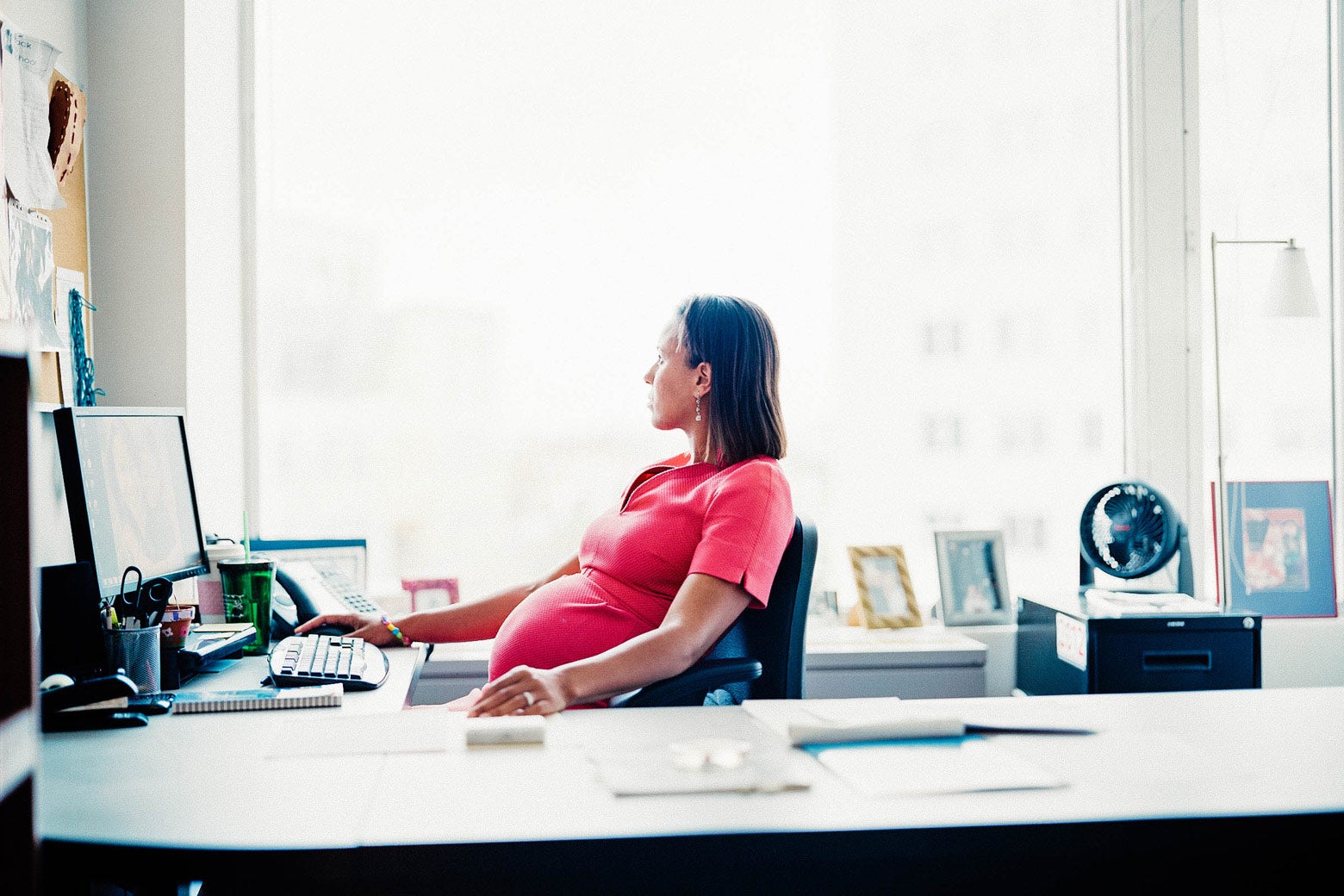 Kalahn sits at a desk in her office.