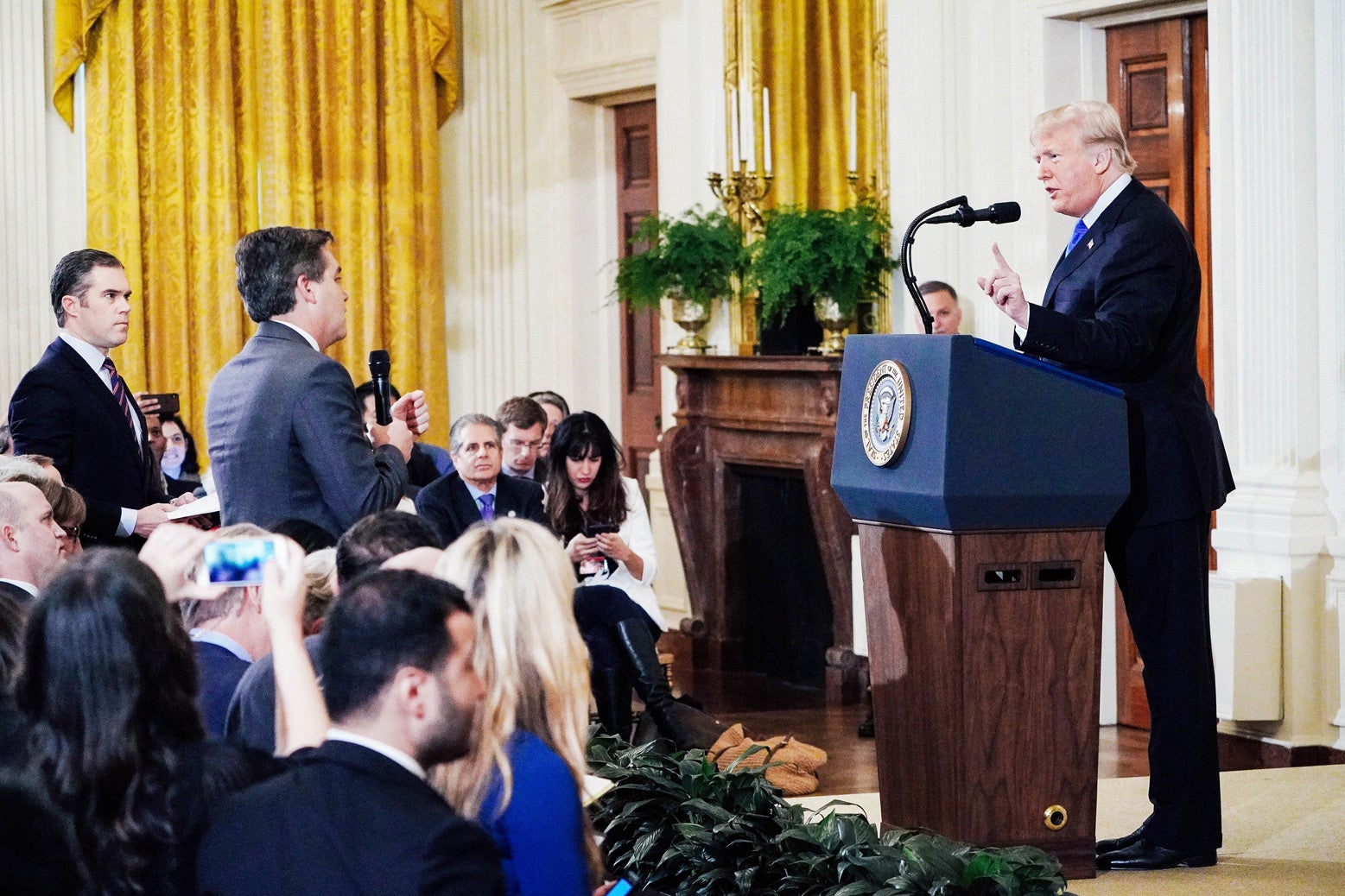 Donald Trump pointing to Jim Acosta, the CNN reporter, during a press conference in the White House.
