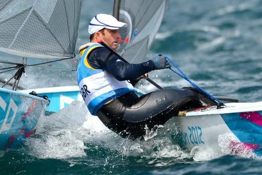 Ben Ainslie leaning over in his boat