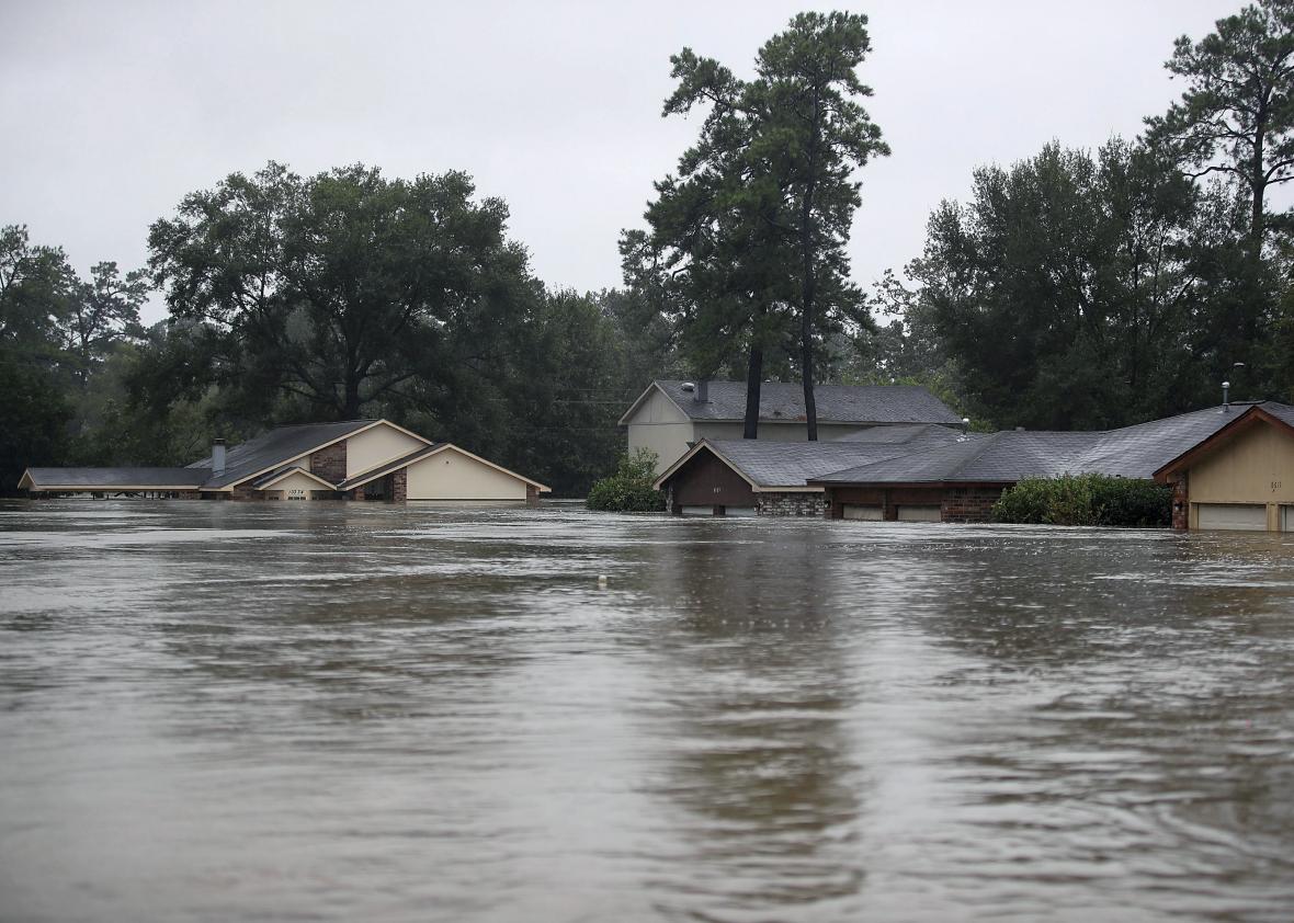 Homes are seen inundated with flooding from Hurricane Harvey on August 28, 2017 in Houston, Texas. Harvey, which made landfall north of Corpus Christi late Friday evening, is expected to dump upwards to 40 inches of rain in Texas over the next couple of days. 