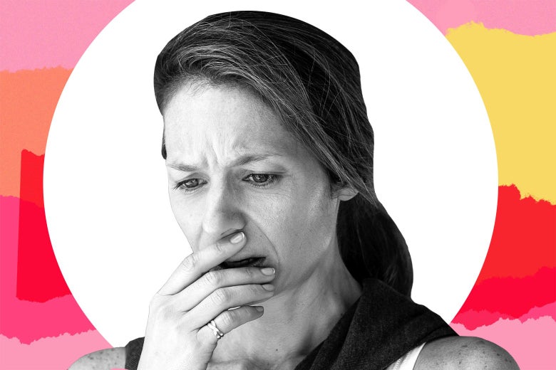 A woman looking down, horrified.