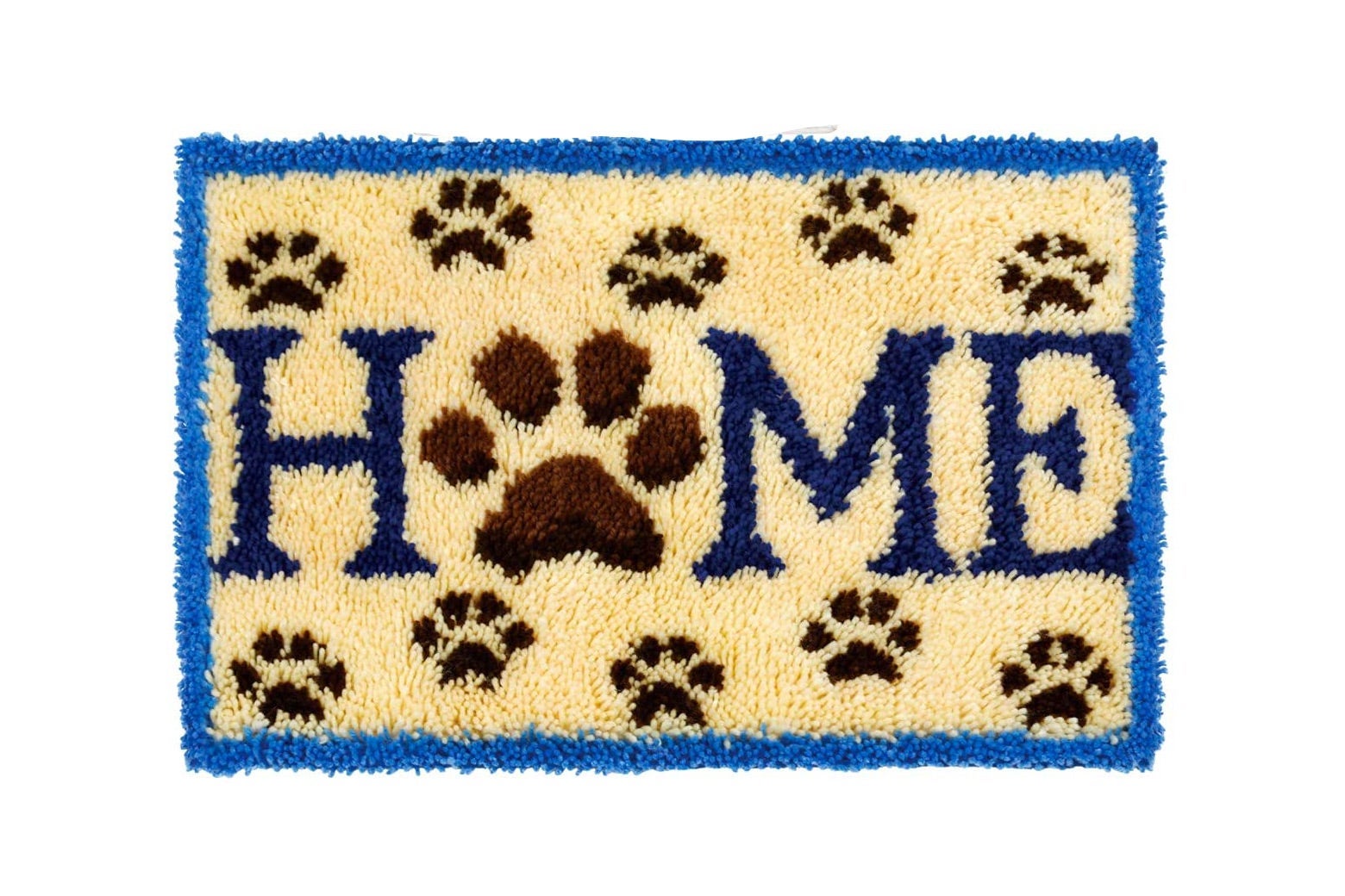 A rug that says HOME with a paw for the O. 
