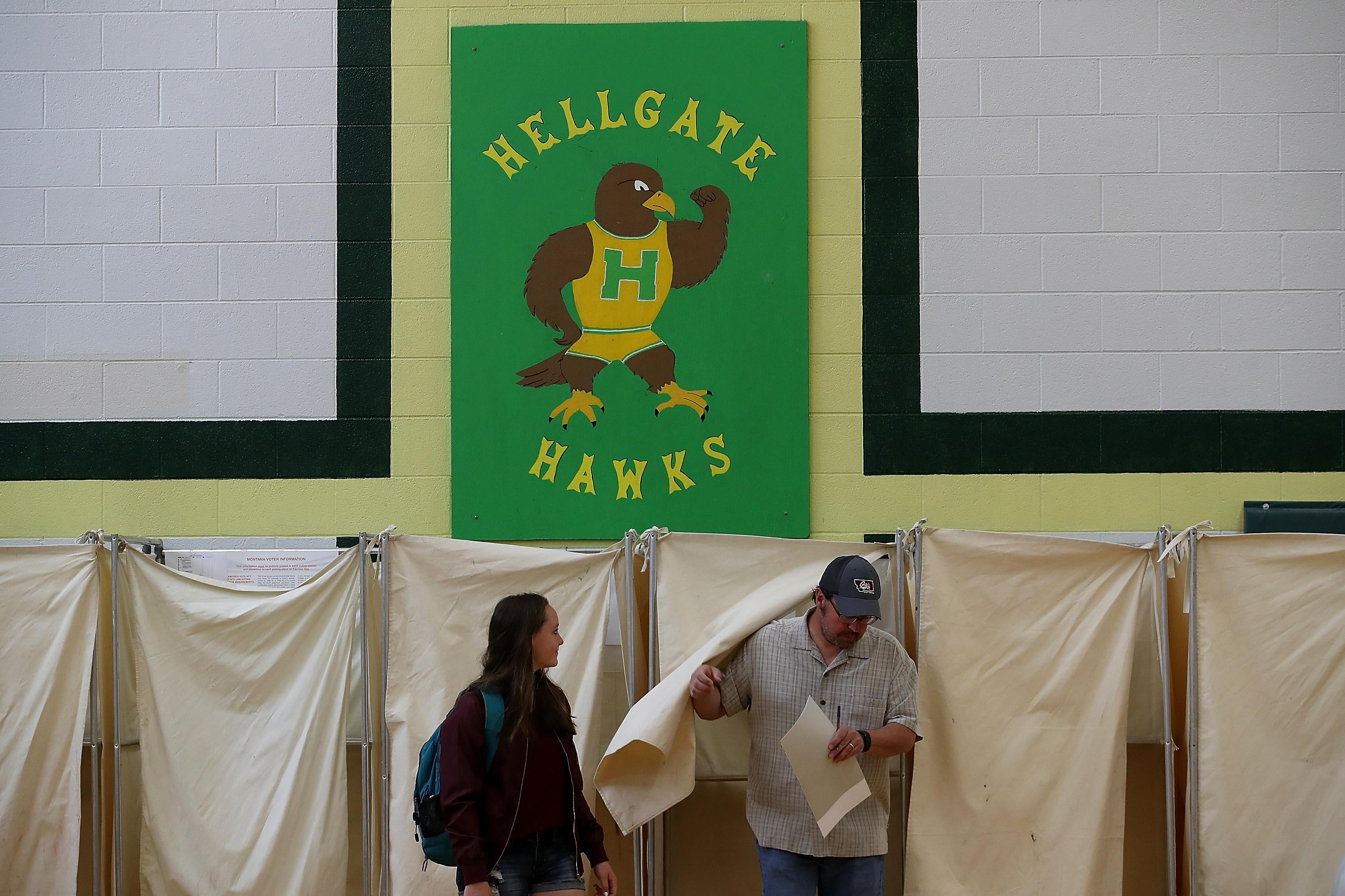  A voter exits a voting booth in a polling station at Hellgate Elementary School on May 25, 2017 in Missoula, Montana. 