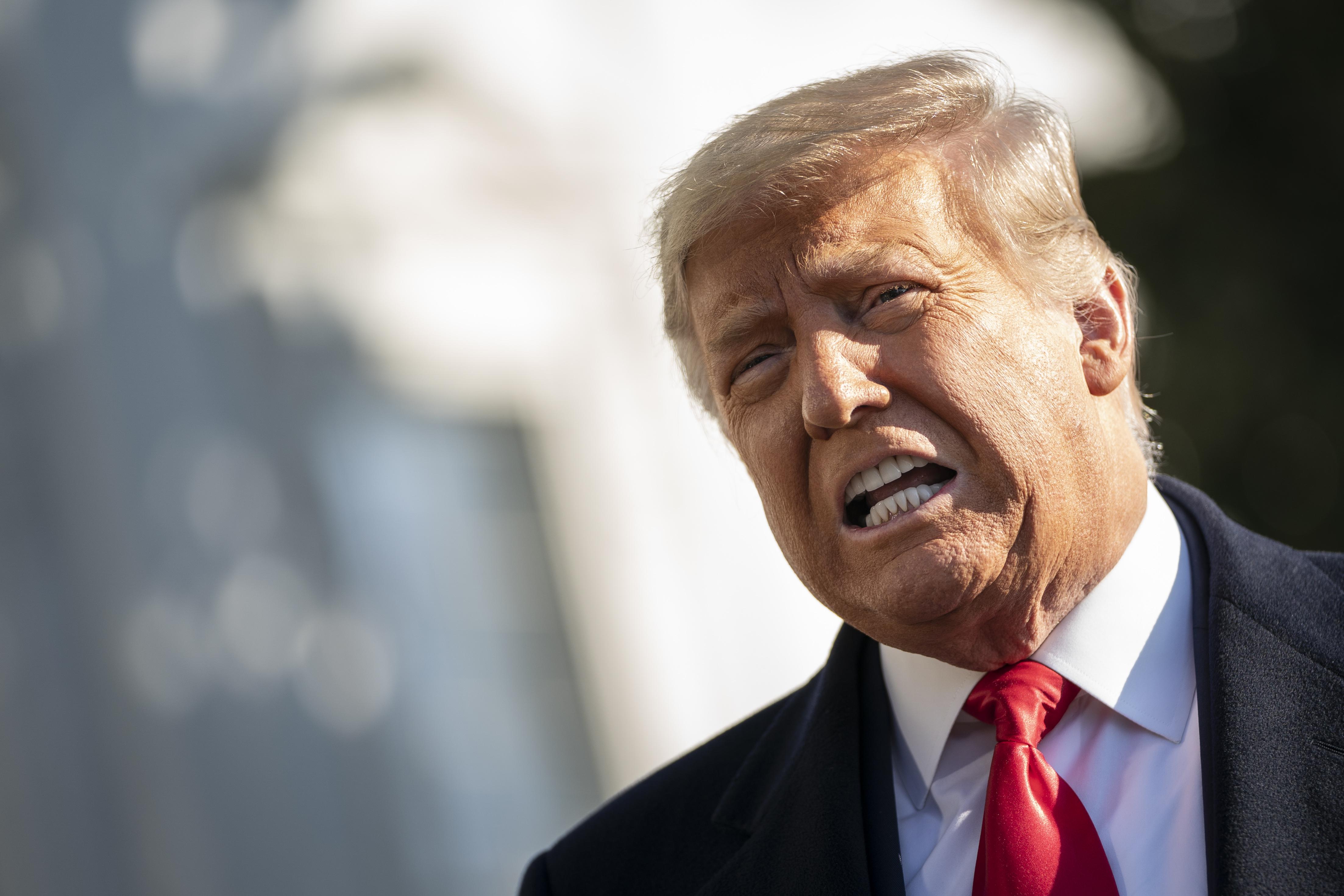 Donald Trump grimacing midsentence.