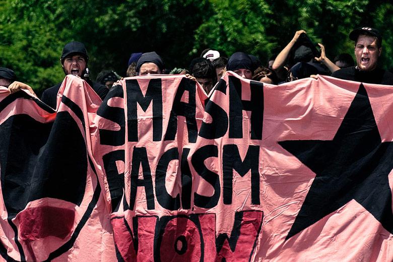 Members of Anti-Racist Action march to protest a National Socialist Movement Rally.