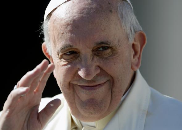 Pope Francis waves at the end of his weekly general audience on March 5, 2014. 