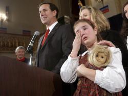 U.S. Senator Rick Santorum stands next to his wife Karen and his daughter Sarah Maria.